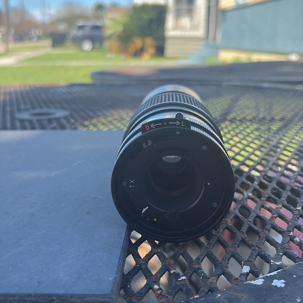 The image shows a Vivitar 300mm 1:5.6 lens. Additional information: